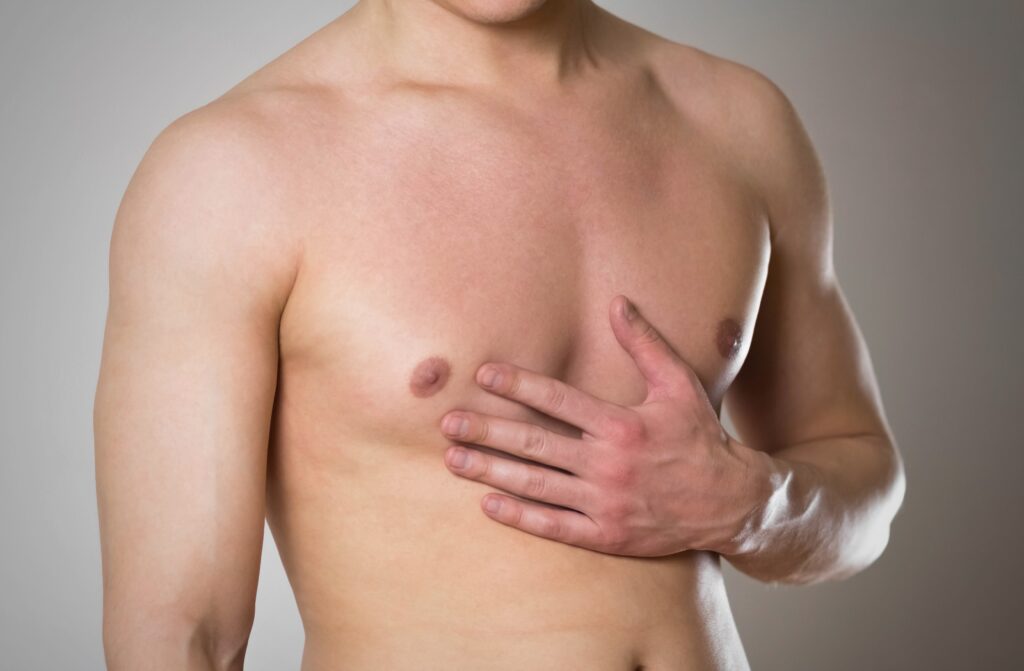 A man holding his chest.
